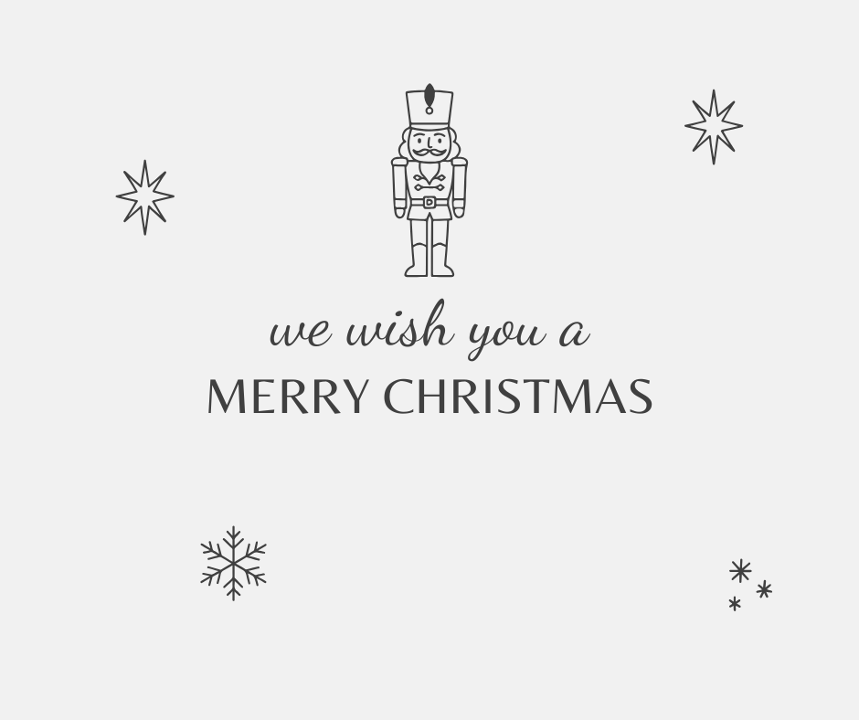 Christmas card with 'we wish you a MERRY CHRISTMAS' text, nutcracker, and snowflakes on a white background