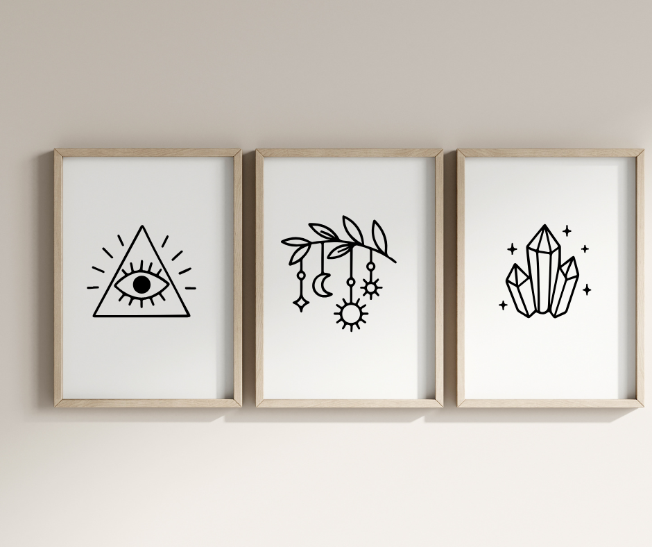Three framed prints with geometric designs on a plain wall.